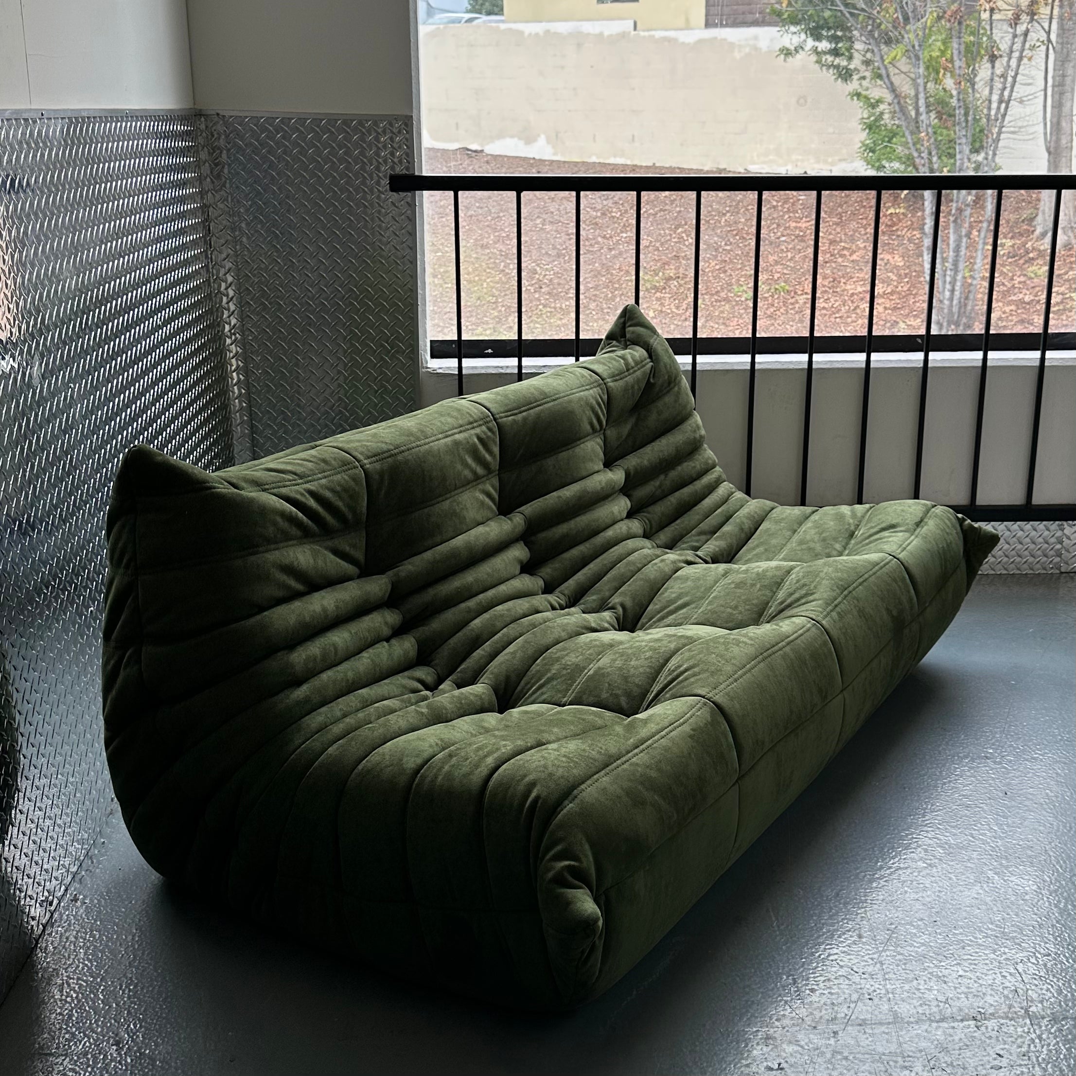 Moss green sofa designed in France 
